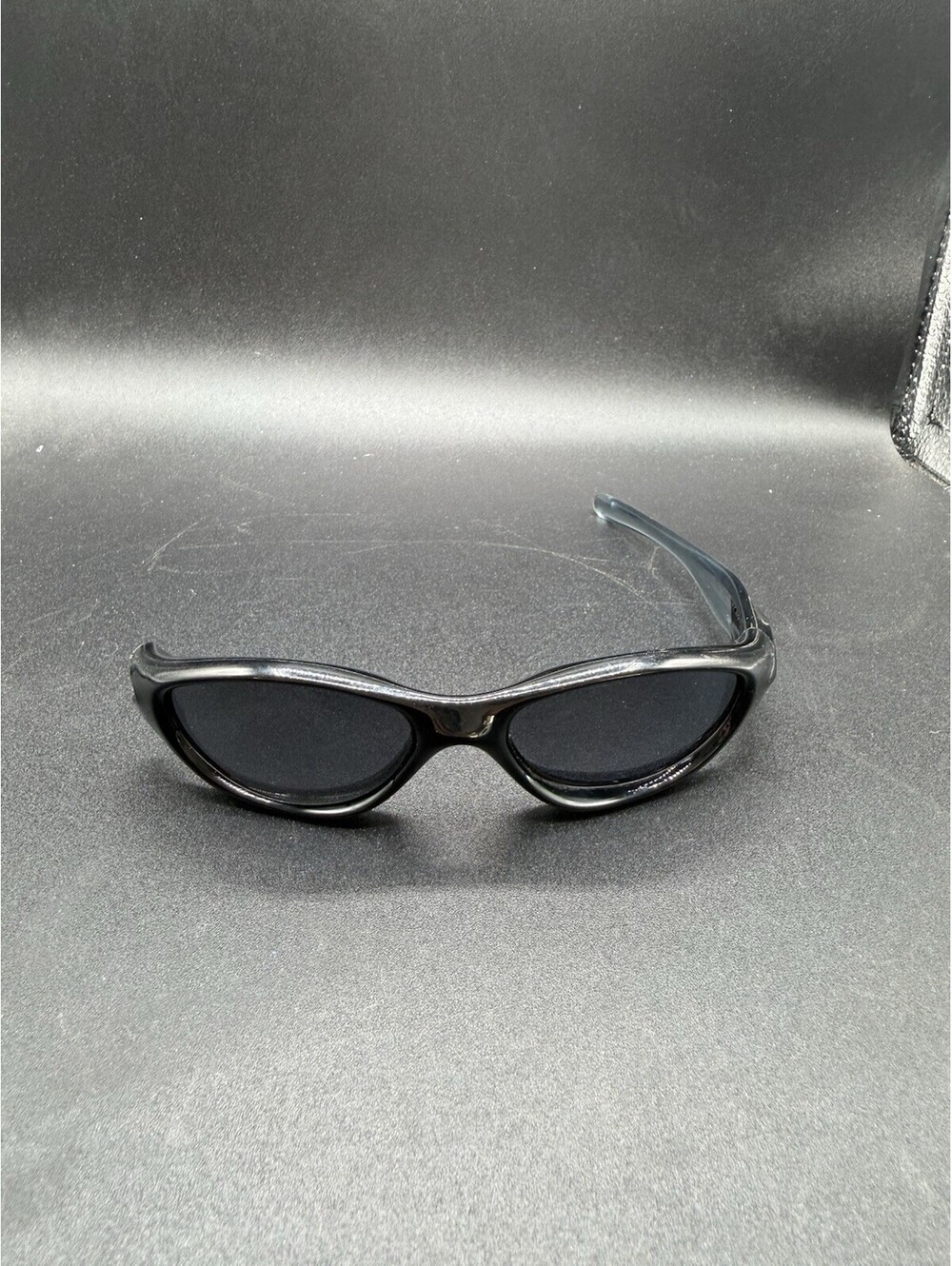 Oakley Pocket Polished Black/Black Iridium Lenses (Missing Right Arm)